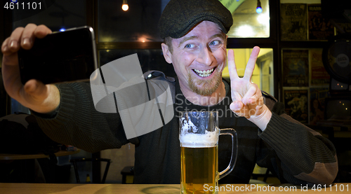 Image of Guy and phone in the bar