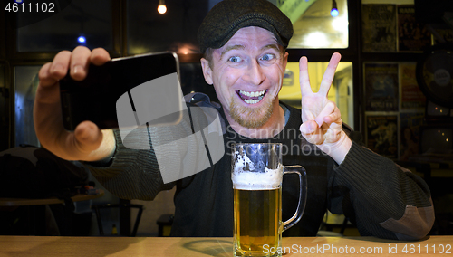 Image of Guy and phone in the bar