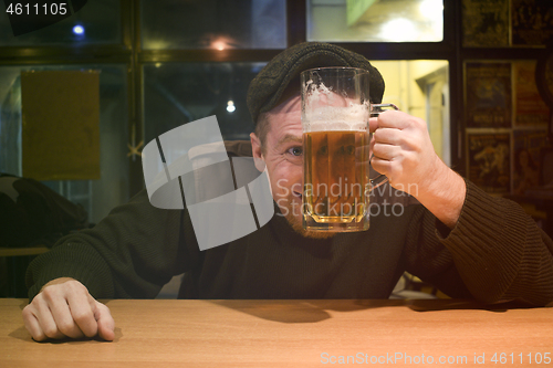 Image of Guy and phone in the bar