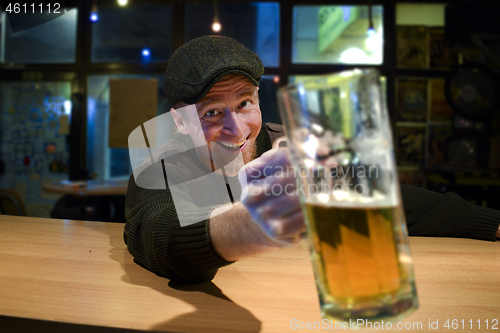 Image of Guy with beer in the bar