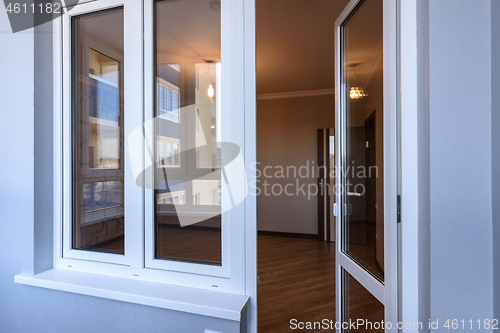 Image of Window and door from a glazed balcony to the room