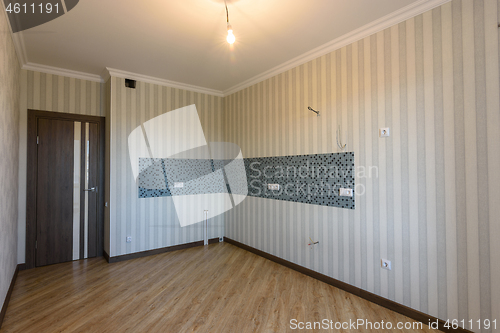 Image of Interior of an empty kitchen after repairs