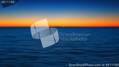 Image of Sunset Seascape Background With Fiery Glow Over Horizon