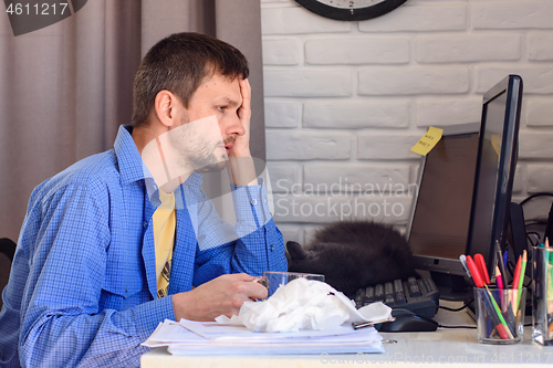 Image of Quarantined male patient with virus works remotely