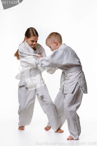 Image of Boy and girl fight and try to make each other\'s cuts