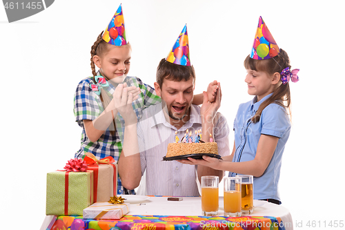 Image of Dad is very happy about the festive sweet surprise prepared by the children