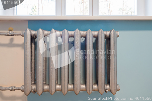 Image of Cast iron radiator of water on the wall