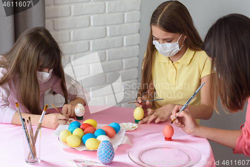 Image of Quarantined sick family paints eggs for Easter