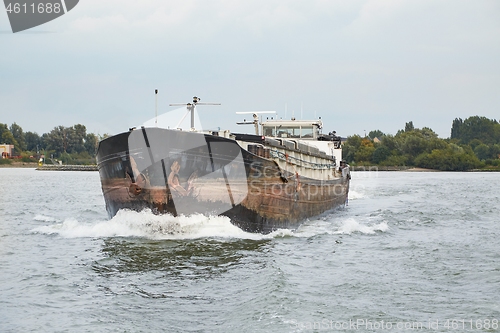 Image of Ship carrying cargo on a river