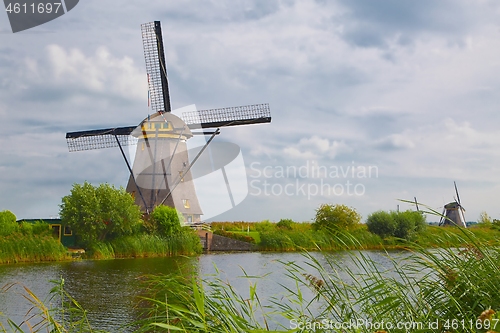 Image of Windmill beside a canal
