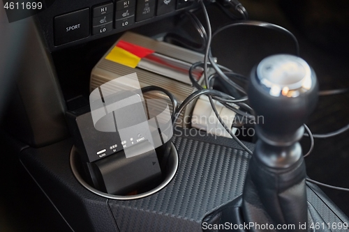 Image of Charging camera batteries in a car