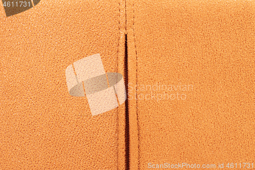Image of Background from brown suede close up, zipper in the middle