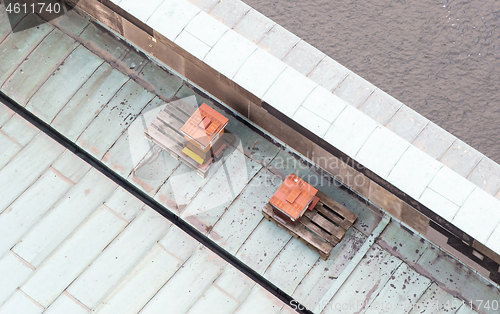 Image of Bee hive on top of a roof