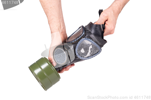 Image of Man holding vintage gasmask isolated on white - Green filter