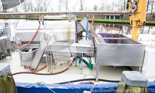 Image of Machine for processing fish on a boat