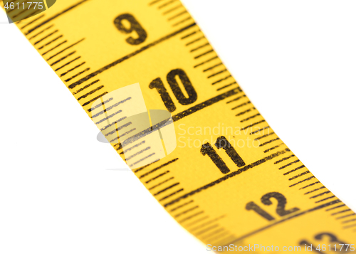 Image of Close-up of a yellow measuring tape isolated on white - 11
