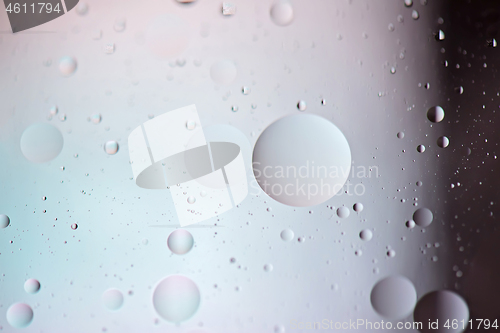 Image of Defocused pastel and dark colored abstract background picture made with oil, water and soap