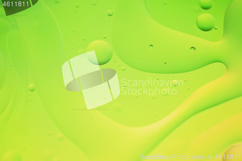 Image of Green and yellow abstract background picture made with oil, water and soap