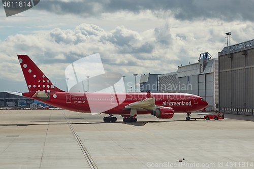 Image of Plane going it the hangar