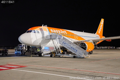 Image of Aircraft at an airport at night