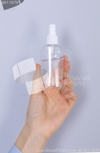 Image of Close up woman hands using hands sanitizer alcohol gel