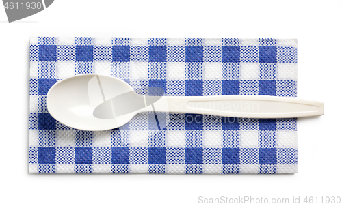 Image of white take away spoon and paper napkin