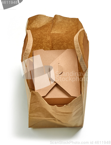 Image of cardboard box in paper bag