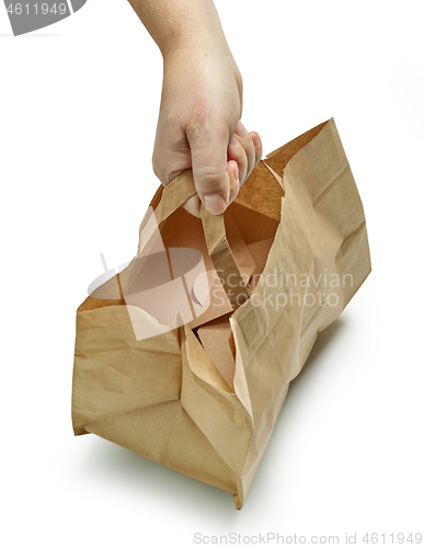 Image of paper bag in human hand