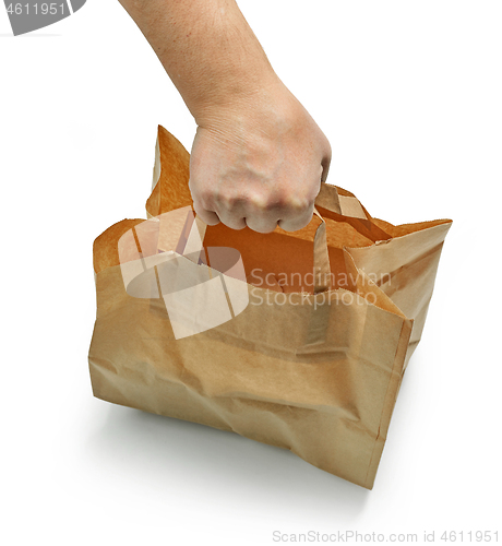 Image of paper bag in human hand