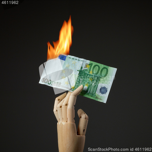 Image of burning euro banknote