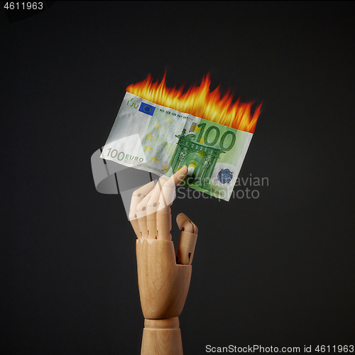 Image of burning euro banknote