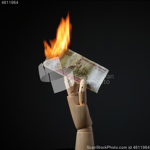 Image of burning ruble banknote