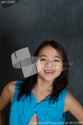 Image of Portrait of a young cute girl looking at the camera