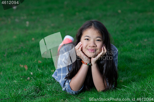 Image of Portrait of a young cute girl looking at the camera