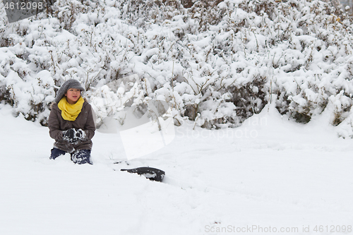 Image of Girl playing in the snow in winter in denmark