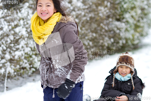 Image of Girl playing in the snow in winter in denmark