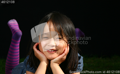 Image of Portrait of a young cute girl looking at the camera