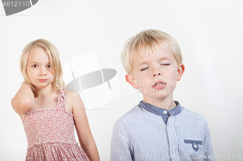 Image of Portrait of a brother and sister in studio