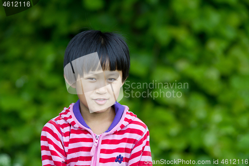 Image of Portrait of a young cute girl looking at the camera