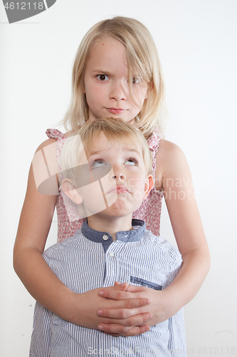 Image of Portrait of a brother and sister in studio