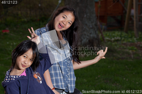 Image of Portrait of a young sisters looking at the camera