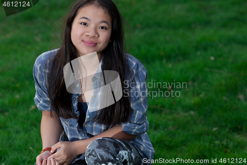 Image of Portrait of a young cute girl looking at the camera