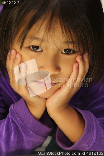 Image of Portrait of a young cute girl looking at the camera