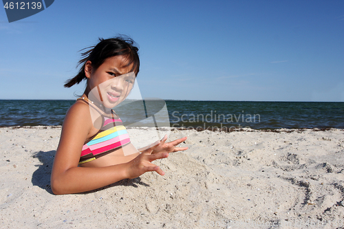 Image of Cute girl at the beach in the summer