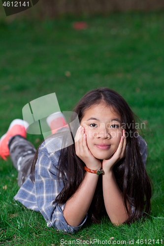 Image of Portrait of a young cute girl looking at the camera