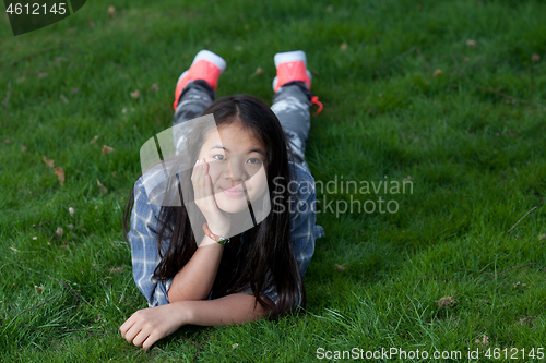 Image of Portrait of a young cute girl looking at the camera