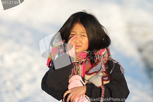 Image of Portrait of a young cute girl looking at the camera