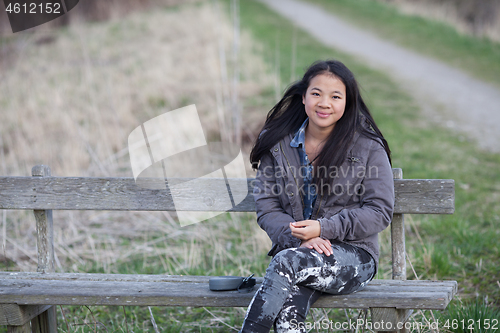 Image of Portrait of a young cute girl looking at the camera