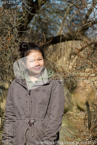 Image of Portrait of a young cute girl looking at the camera