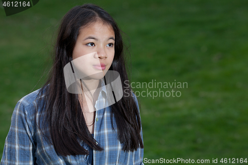 Image of Portrait of a young cute girl looking at the camera